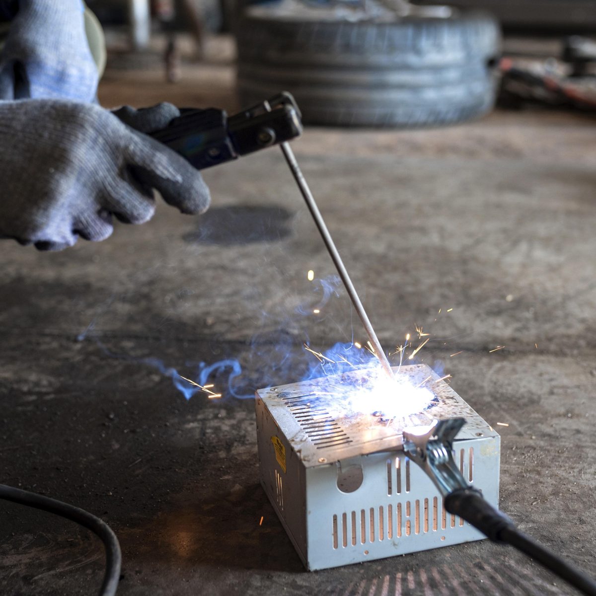 male-mechanic-working-his-workshop-min